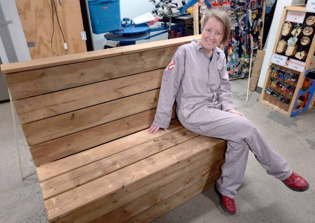 Becca Denley sits on a &lsquo;parklet&rsquo; that was built at Makerspace for the human library initiative she&rsquo;s helping to start in the city next month. Photo courtesy of Becca Denley